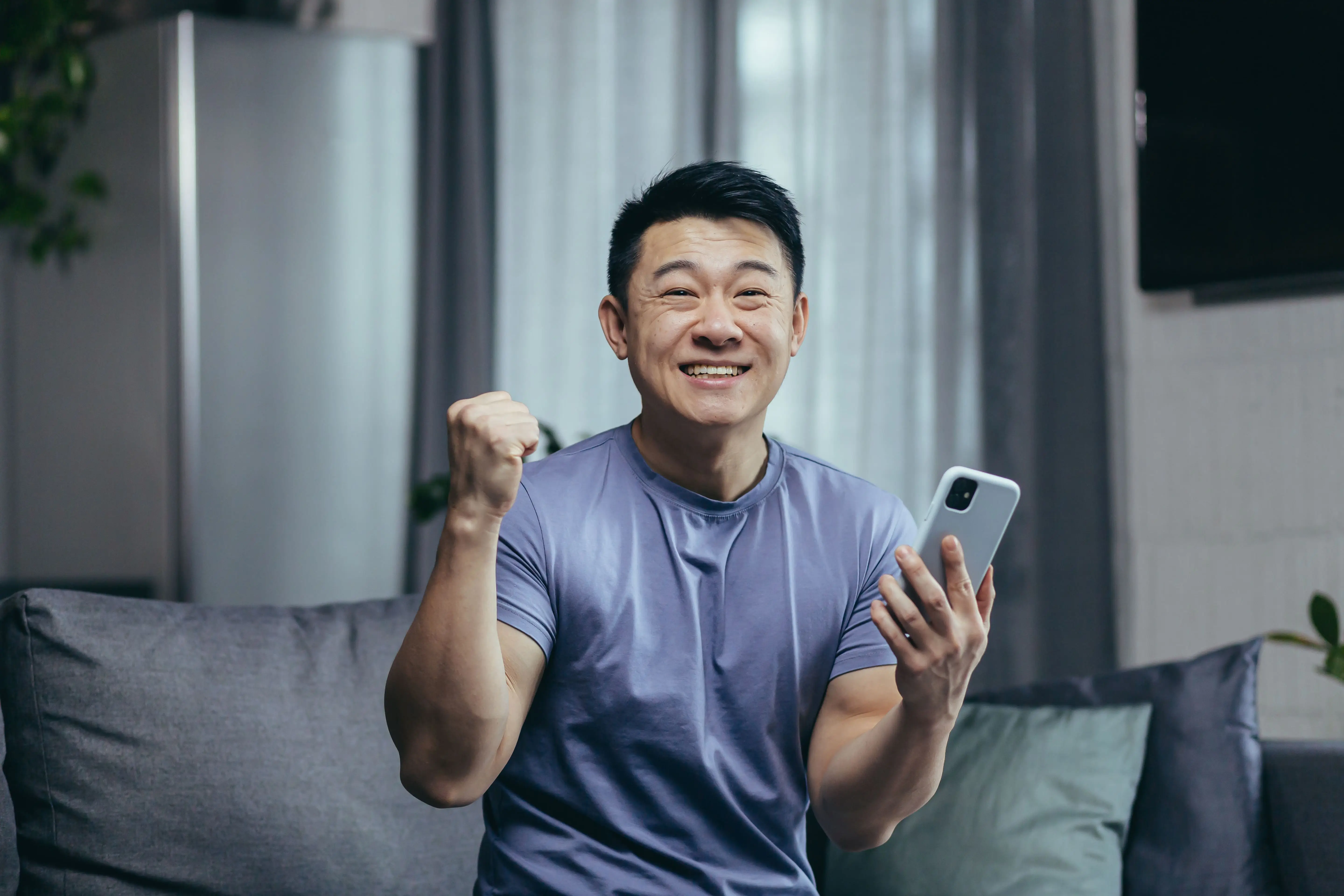 Man excited playing sportbetting on winbox image